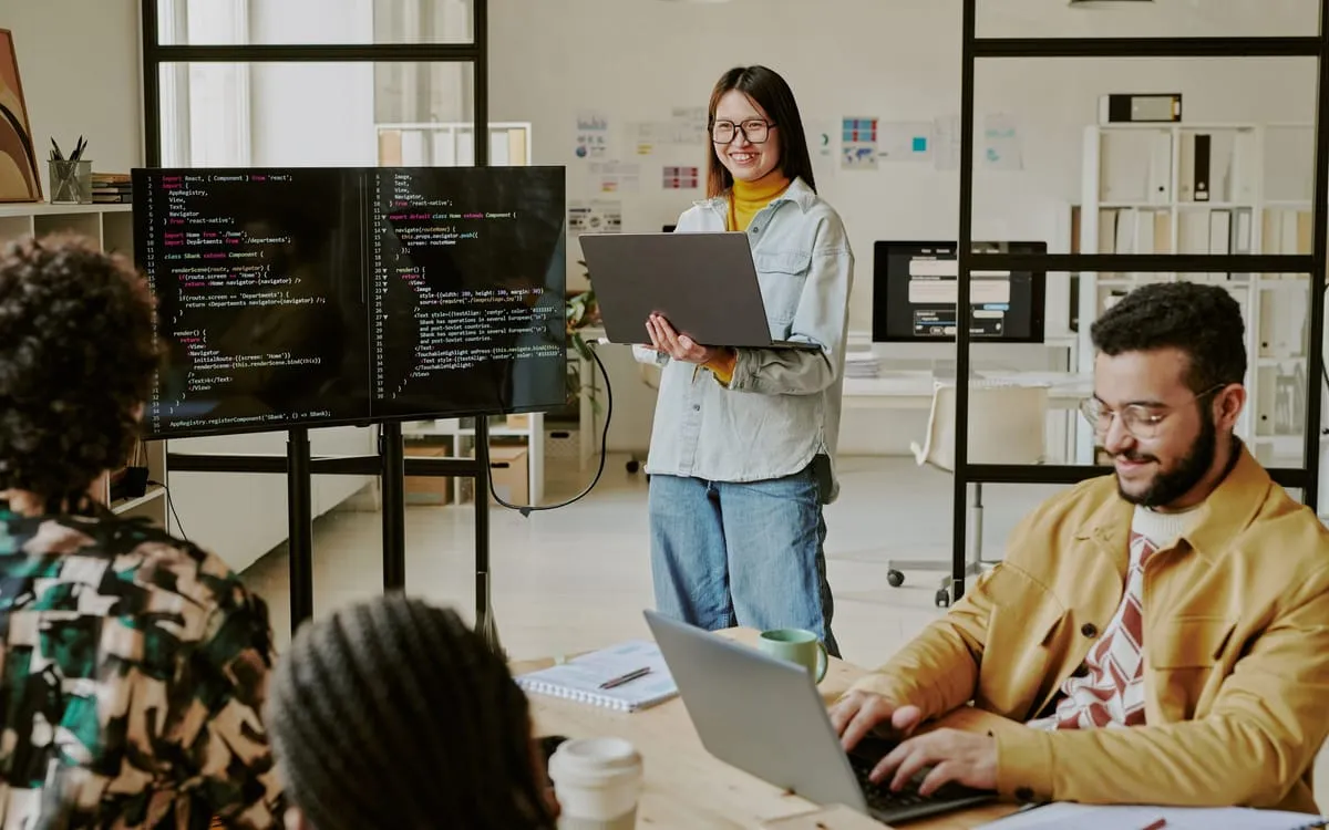 Three members of the Fold Systems IT Operations team working through a vendor review together